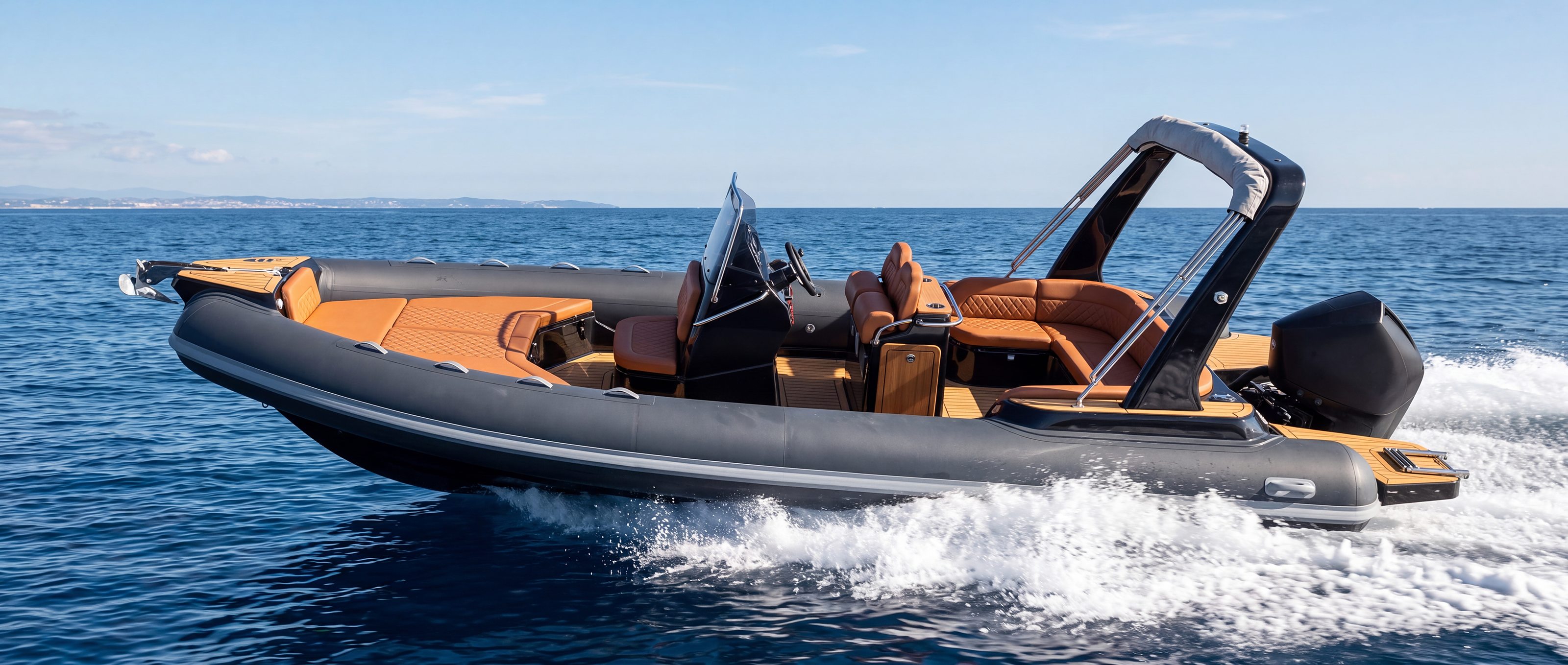 Naviglia vision: the anthracite NAVY 7.60 planing, seen in profile, tan upholstery and white wake